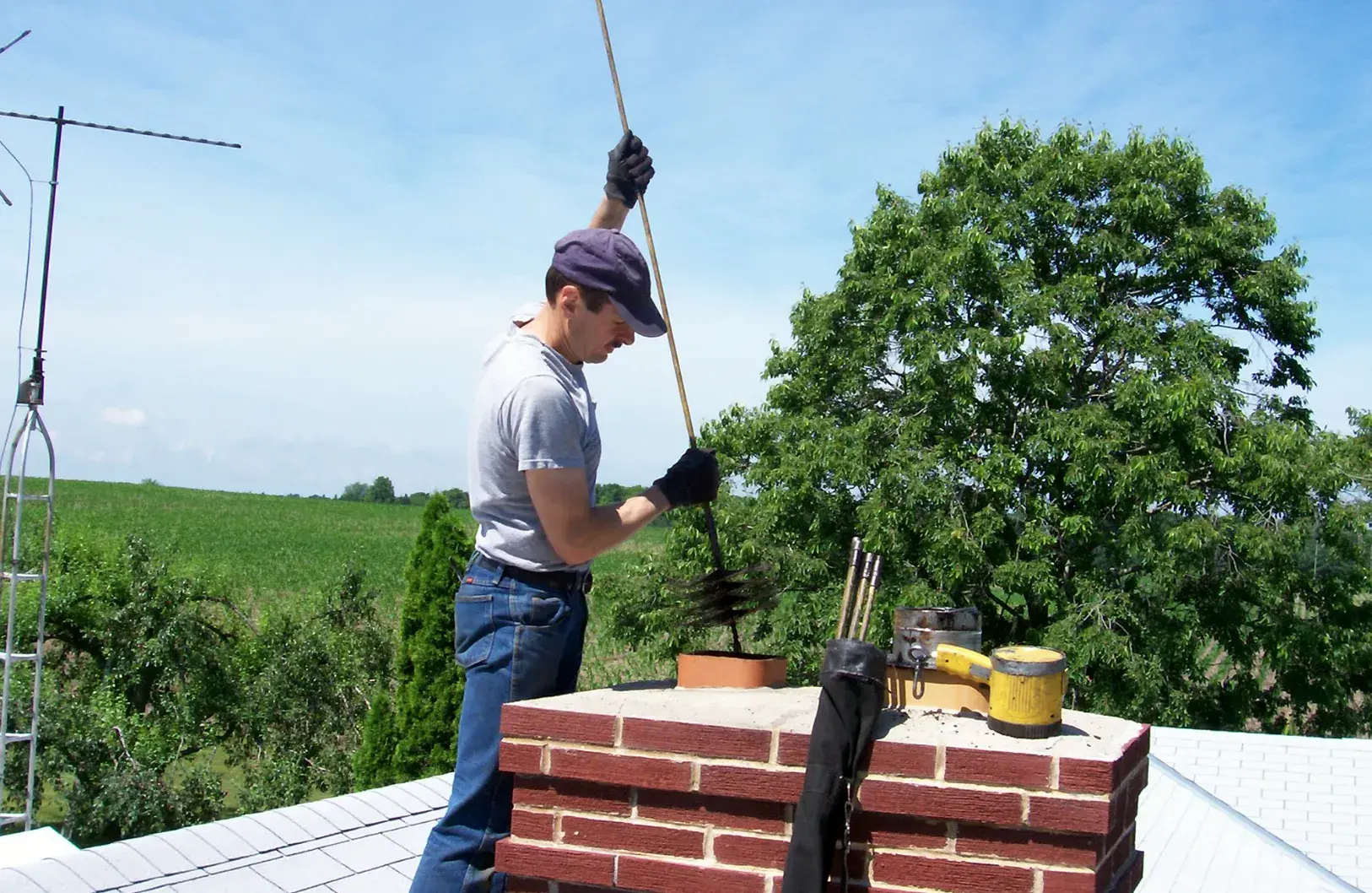 Chimney Cleaning provided by Top Hat Chimney And Roofing