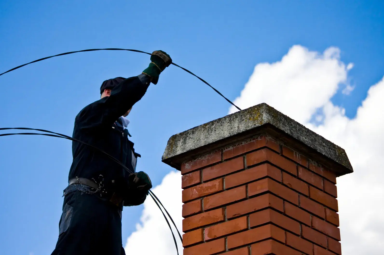 Chimney Cleaning provided by Top Hat Chimney And Roofing