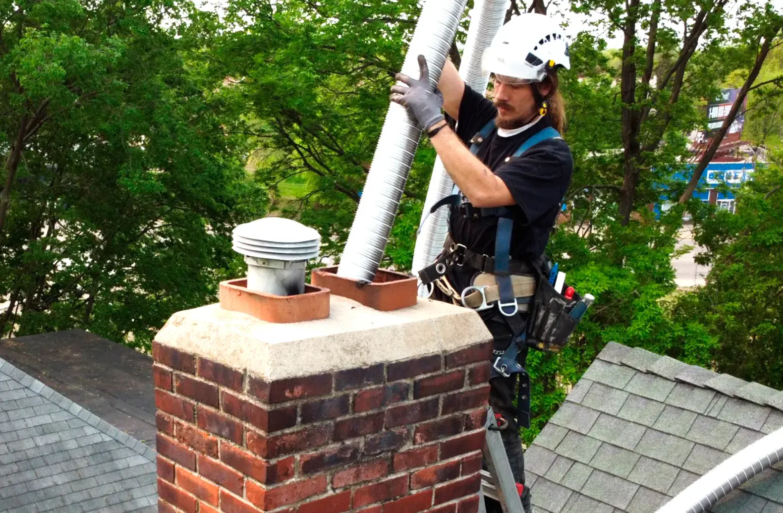 Chimney Cleaning provided by Top Hat Chimney And Roofing